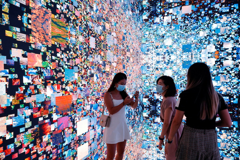 Visitors at the Digital Art Fair in Hong Kong as global trading in NFTs soar