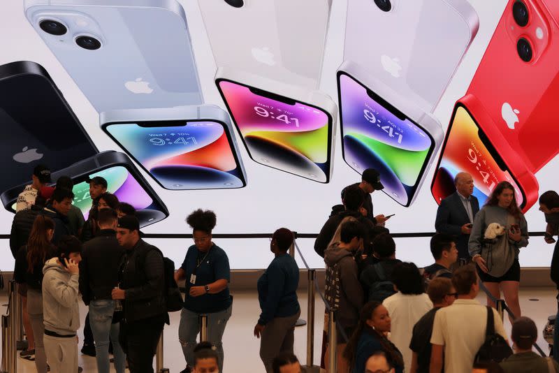 Customers are seen in an Apple store in China. The US tech giant is facing tougher challenges in smartphone sales in its top Asian market. Photo: Reuters