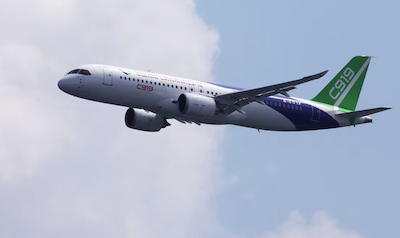 A Comac C919 flies past during an aerial flying display ahead of the Singapore Airshow at Changi Exhibition Centre in Singapore February 18, 2024. REUTERS/Edgar Su Purchase Licensing Rights